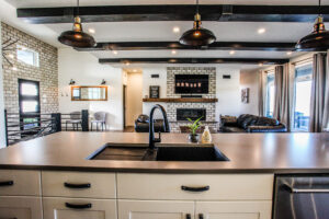 Designer Kitchen With Wood And Black Accents Built By Hillside Construction. Building Custom Homes, Cabins, and Renovations in Manitoba and Kenora.
