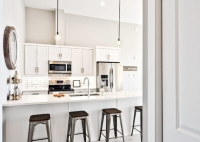 Bright Kitchen and Dining Room In A Multi Family Development Built By Hillside Construction In Manitoba.